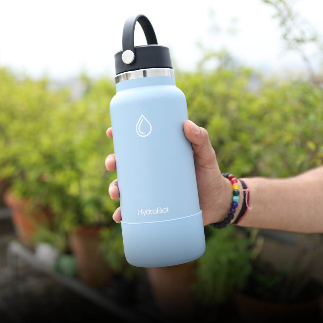 Sleek black French press with wooden handle on a kitchen countertop.