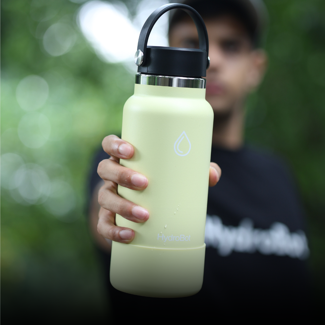 Sleek black French press with wooden handle on a kitchen countertop.