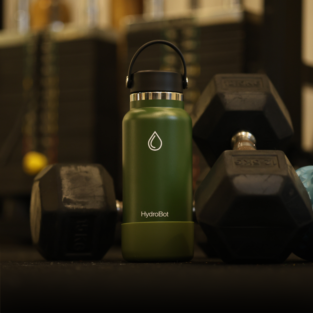 Sleek black French press with wooden handle on a kitchen countertop.