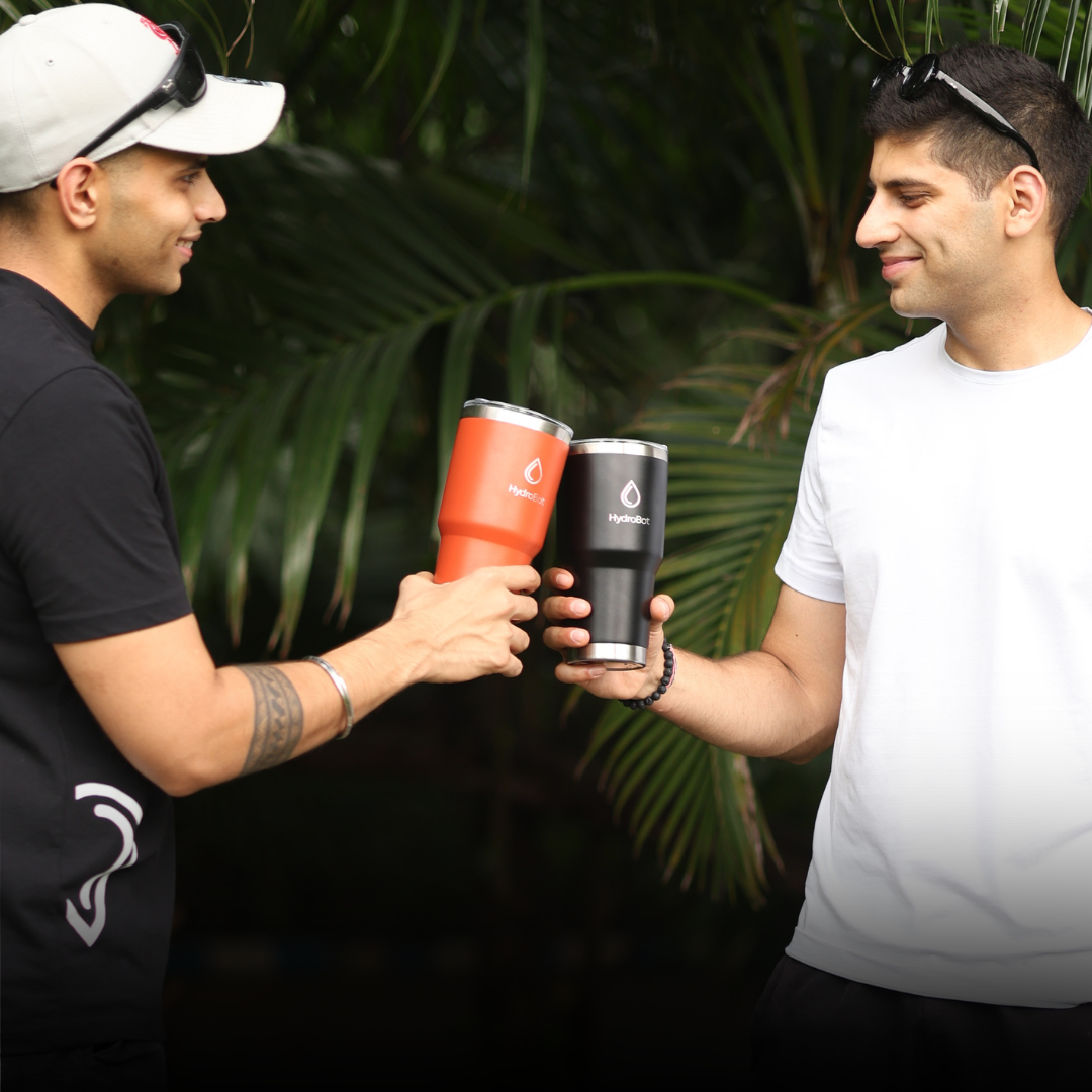 Sleek black French press with wooden handle on a kitchen countertop.