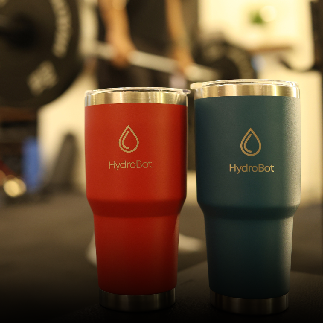 Sleek black French press with wooden handle on a kitchen countertop.