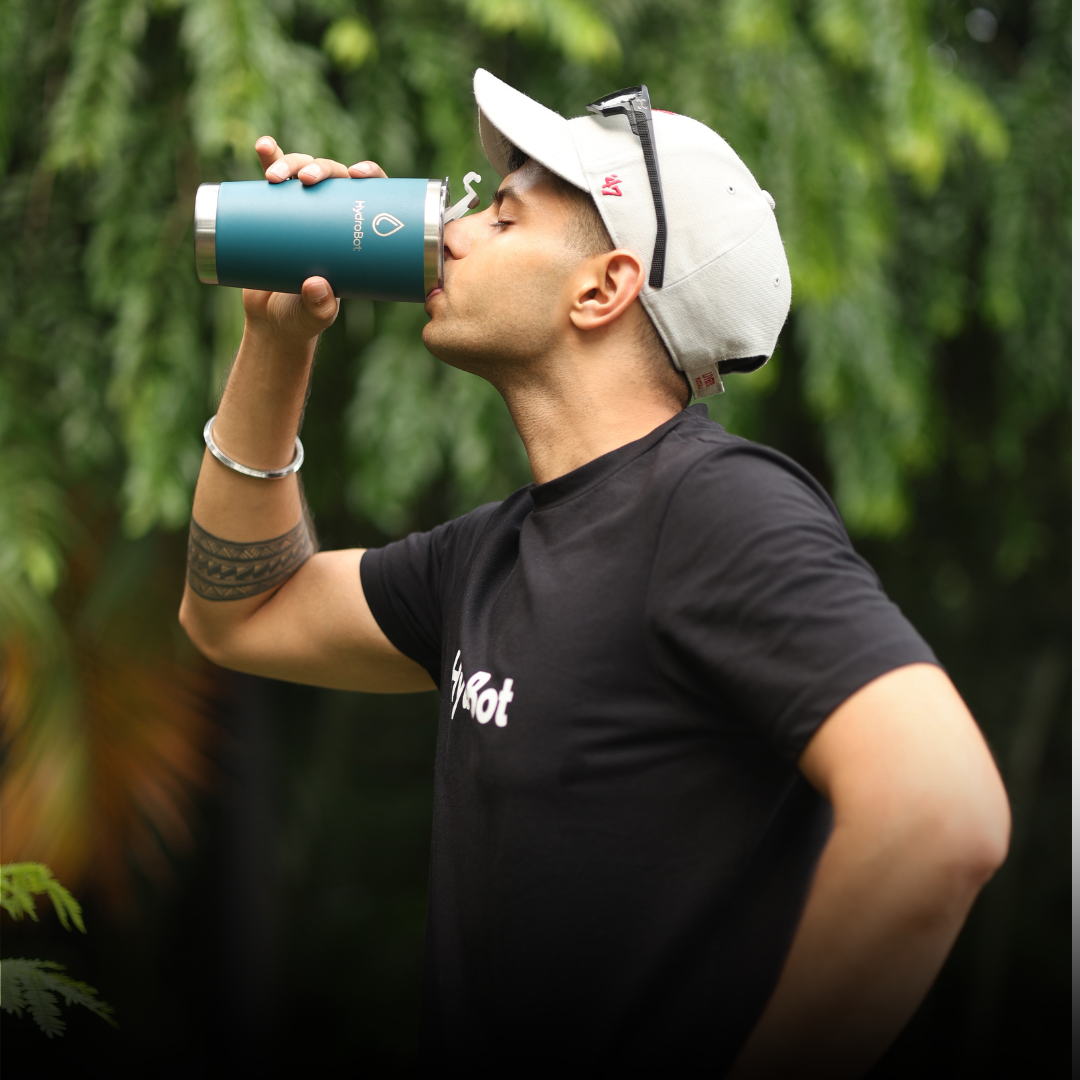 Sleek black French press with wooden handle on a kitchen countertop.