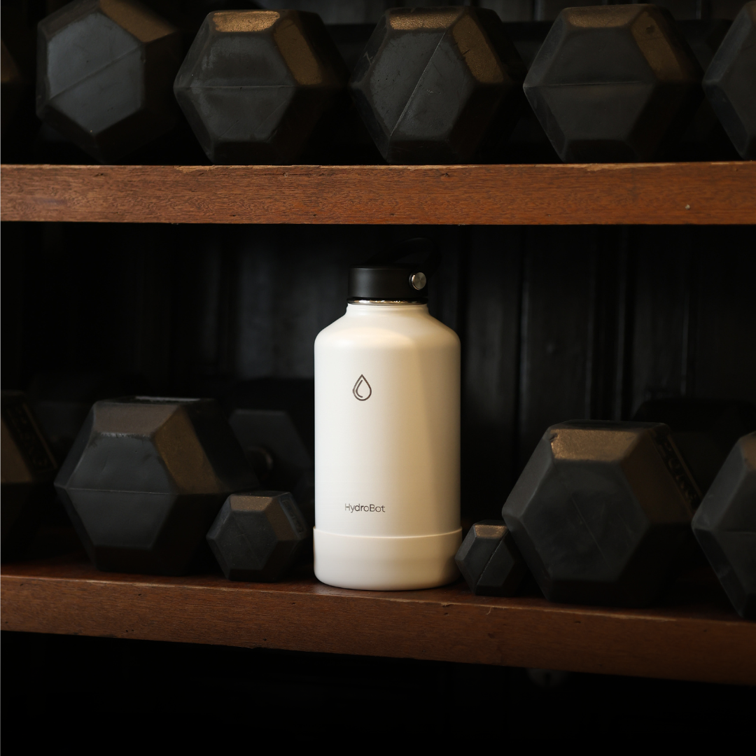 Sleek black French press with wooden handle on a kitchen countertop.