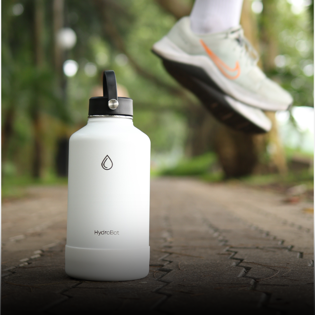 Sleek black French press with wooden handle on a kitchen countertop.