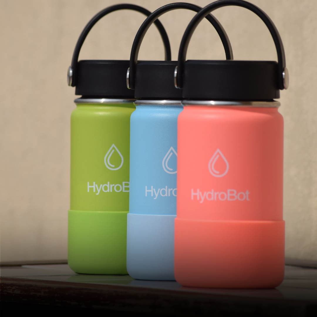 Sleek black French press with wooden handle on a kitchen countertop.