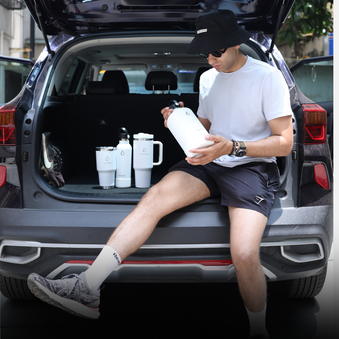 Sleek black French press with wooden handle on a kitchen countertop.