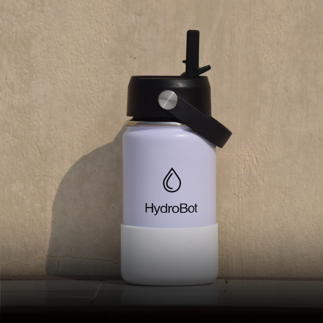 Sleek black French press with wooden handle on a kitchen countertop.