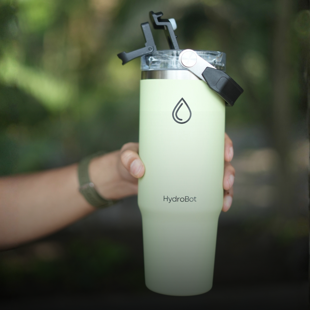 Sleek black French press with wooden handle on a kitchen countertop.